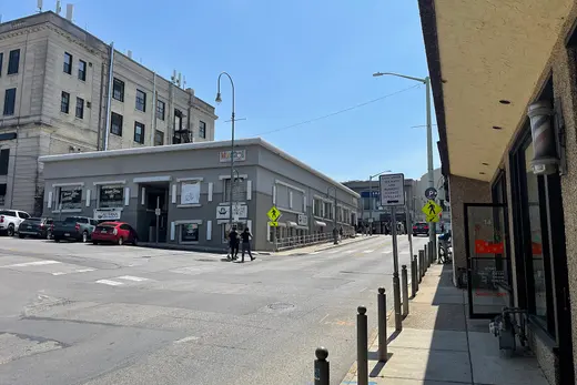 Downtown street intersection with low-rise commercial buildings and pedestrians., Ardmore, Pennsylvania
