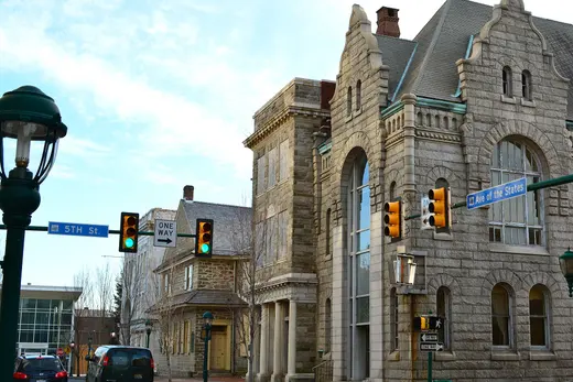 Historic stone buildings on a small town intersection with traffic lights., Chester, Pennsylvania