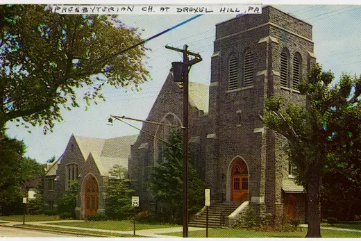 Stone Presbyterian church on a leafy suburban street, Drexel Hill, Pennsylvania