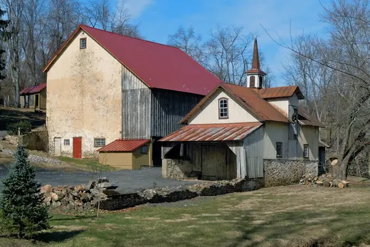 Old barn and attached building with red roofs in a rural setting, East Brandywine Township, Pennsylvania