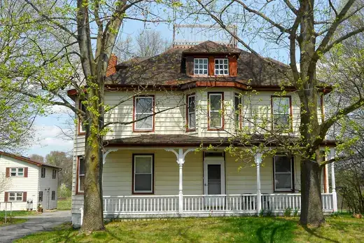 Two-story American house with front porch and trees, Franklin Township, Pennsylvania