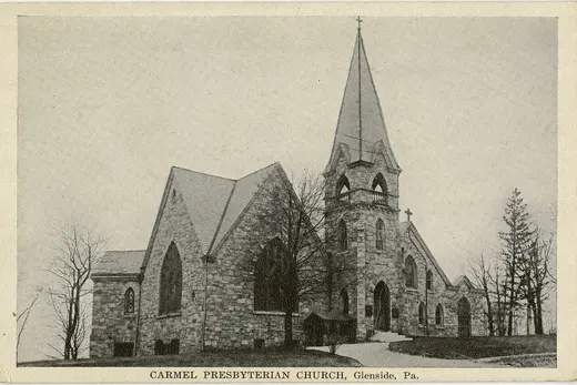 Stone church with tall steeple and arched windows, Glenside, Pennsylvania