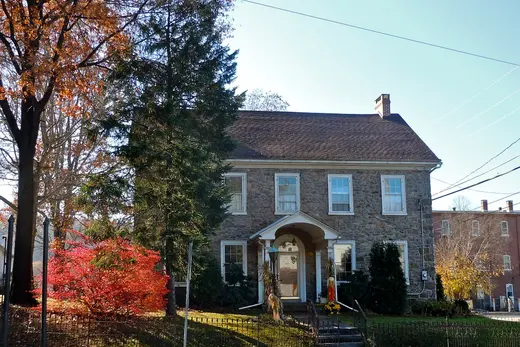 Stone two-story house with trees and a small front yard, Green Lane, Pennsylvania