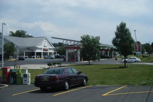Parking lot with car, gas station and convenience store in suburban area., Horsham Township, Pennsylvania