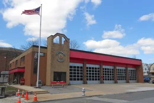 Fire station building with American flag and multiple garage bays., Lansdowne, Pennsylvania