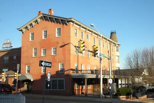 Red brick hotel building on a sunny town street corner, Oxford, Pennsylvania