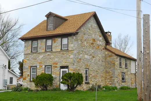 Stone two-story house on a suburban street., Sadsburyville, Pennsylvania