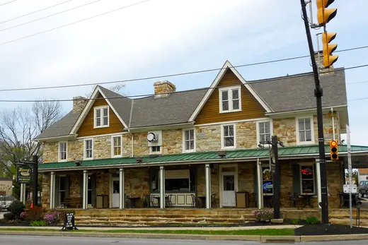 Stone two-story commercial building with green awning on street corner., Sadsburyville, Pennsylvania