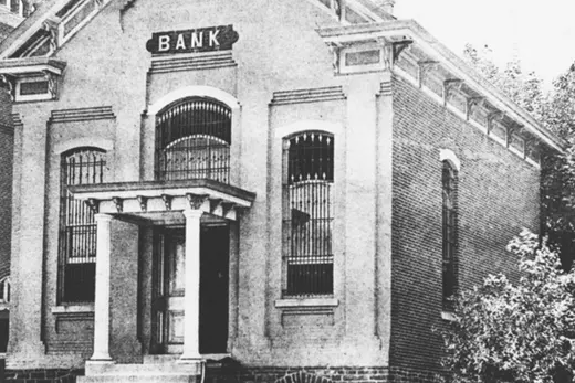 Front facade of a small brick bank building with columned entrance., Souderton, Pennsylvania