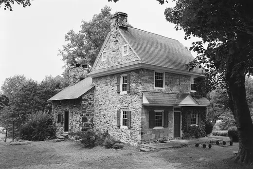 Stone two-story house with trees and grassy lawn., West Goshen Township, Pennsylvania